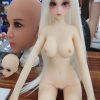 Olivia 60cm anime-style love doll with silicone head and TPE body, stainless steel frame